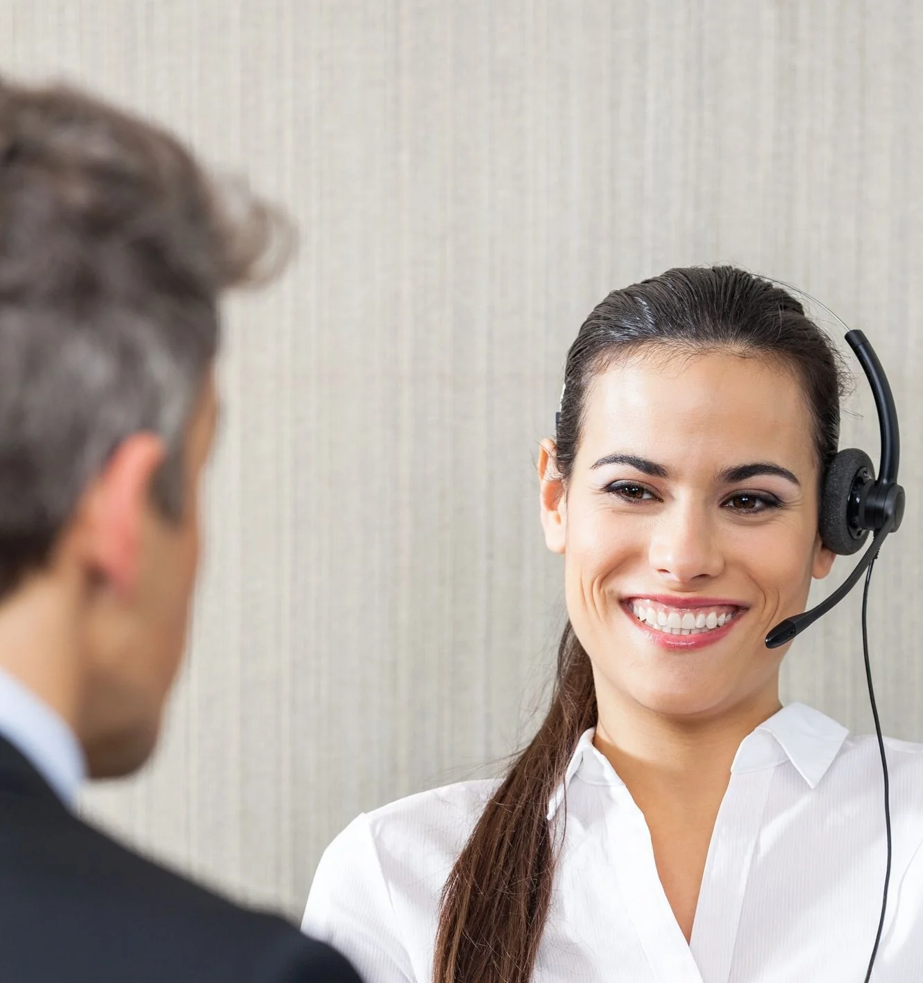 Professional interpreter with headset in a bilateral business meeting