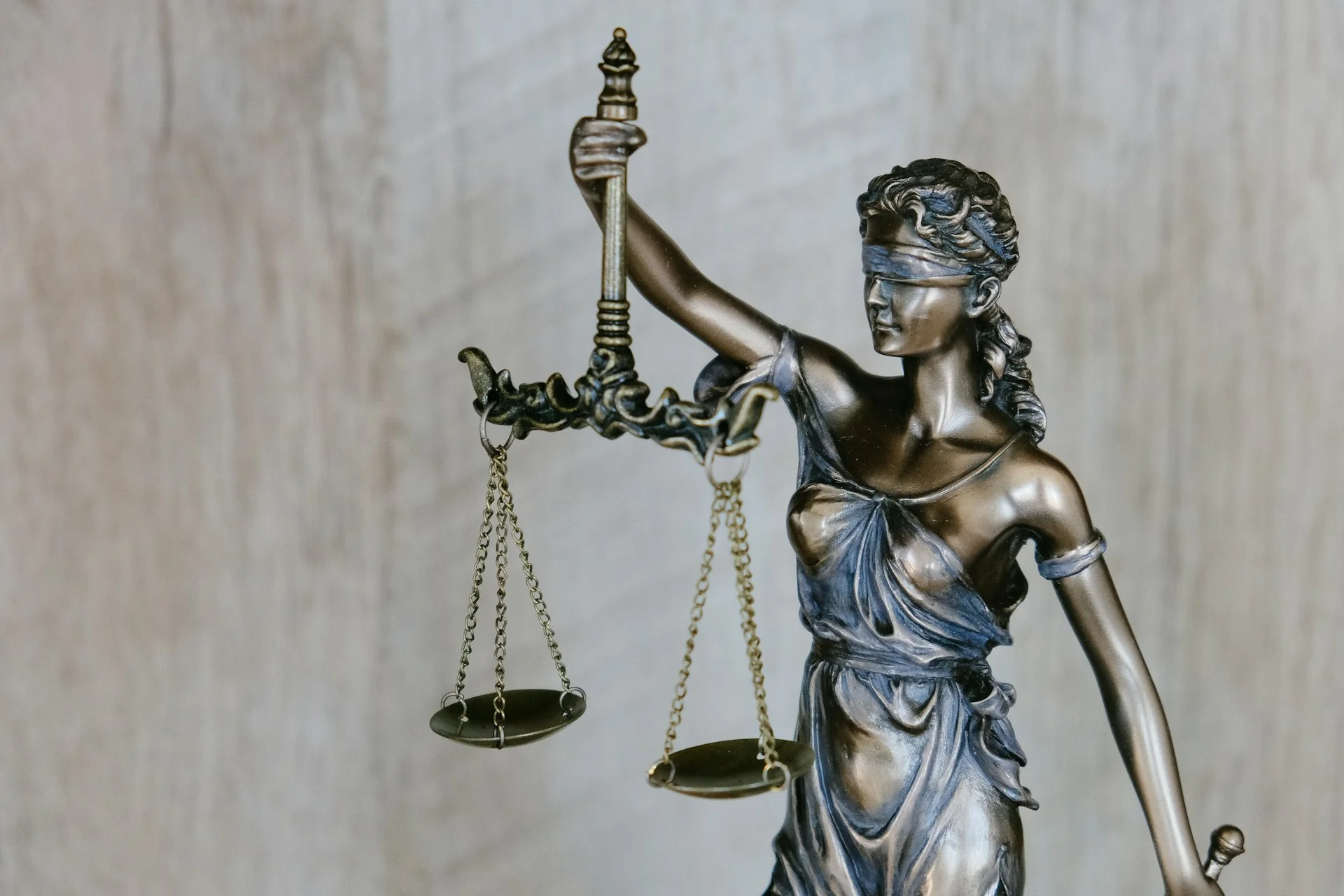 Lady Justice statue and scales symbolizing official certified translation validity